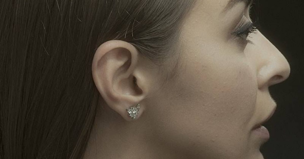 woman with silver stud earring